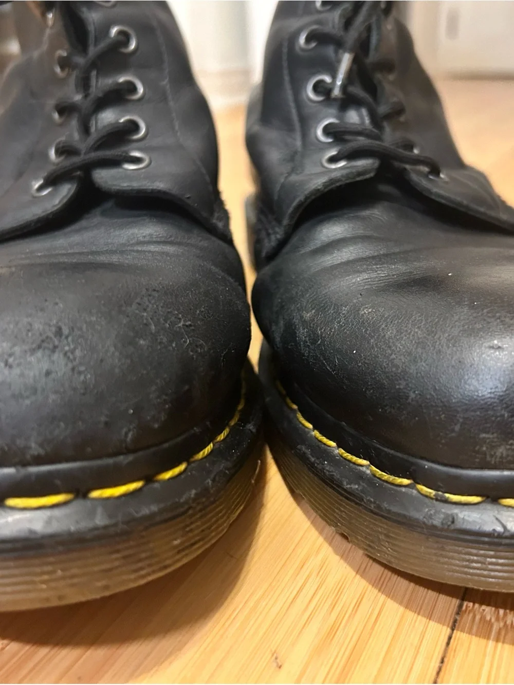 Dr. Martens Black Leather 8-Eye Lace-Up Boots with Yellow Stitching